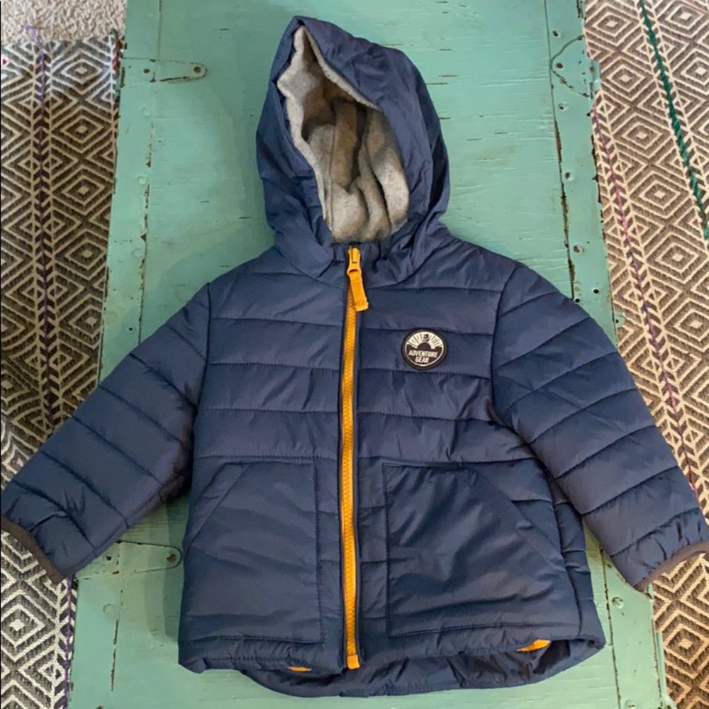 Toddler Carter’s blue jacket.